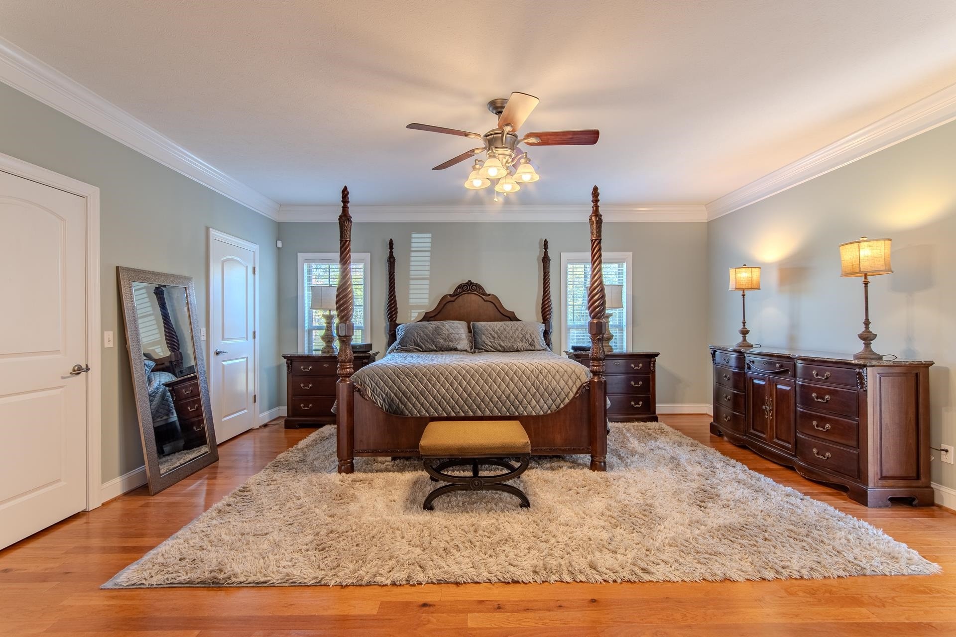 6170 Highway 226 Savannah, TN 38372 - Photo 15 of 40 a bedroom with a bed and a chandelier