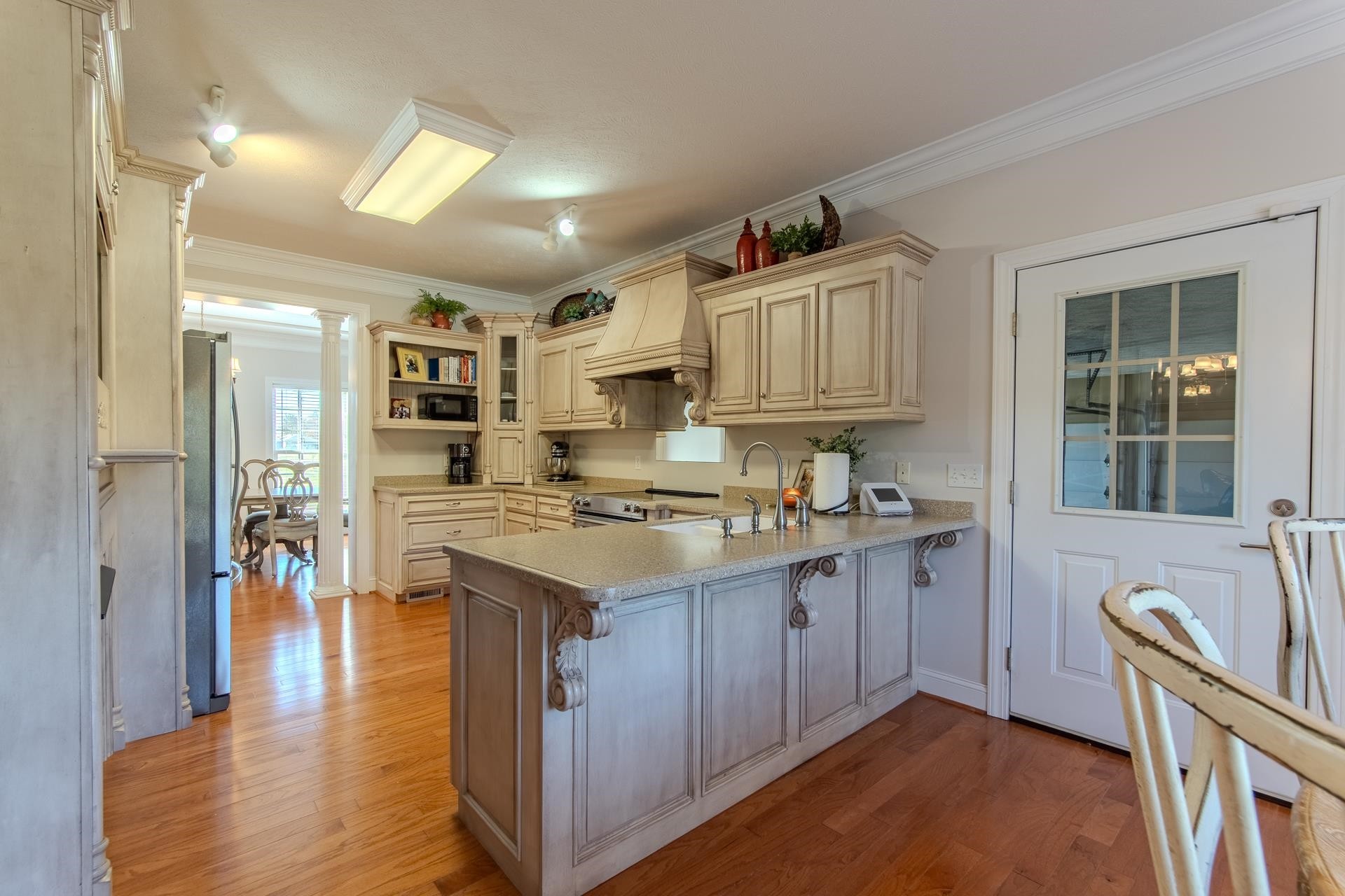 6170 Highway 226 Savannah, TN 38372 - Photo 6 of 40 a kitchen with granite countertop a sink stove and refrigerator