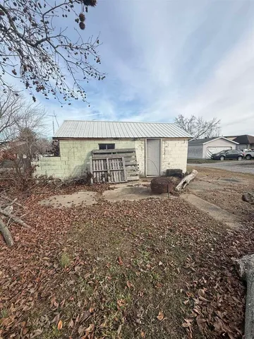 a view of garage and yard