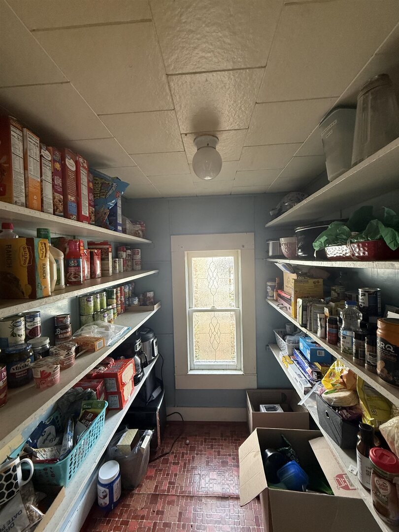 404 South Thomas Street Christopher, IL 62822 - Photo 10 of 16 a room with lots of books and white cabinets
