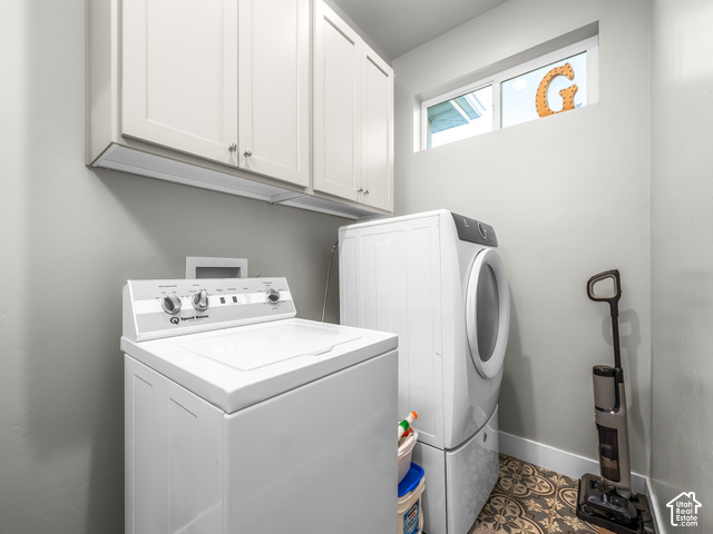 474 North 150th Street East Mapleton, UT 84664 - Photo 15 of 35 White upper cabinetry with brushed nickel hardware, light gray wall paint, patterned floor tile, and a transom window providing natural light