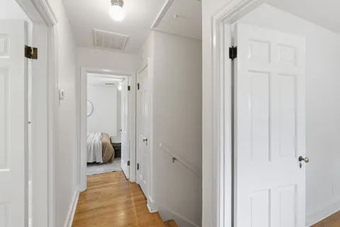 a view of a bathroom from the hallway