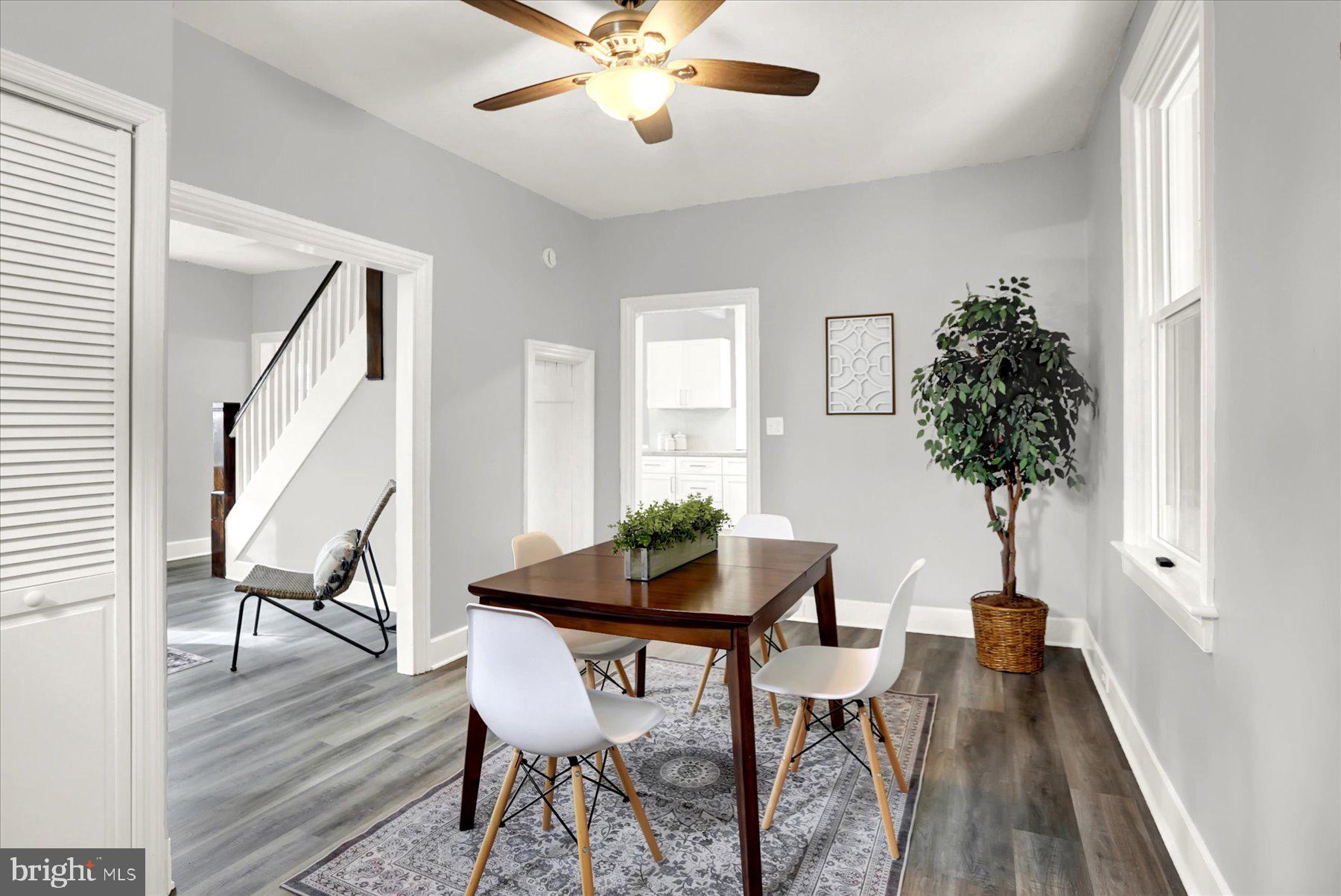 497 State Street Enola, PA 17025 - Photo 13 of 47 a view of a livingroom and dining room with furniture wooden floor and a chandelier