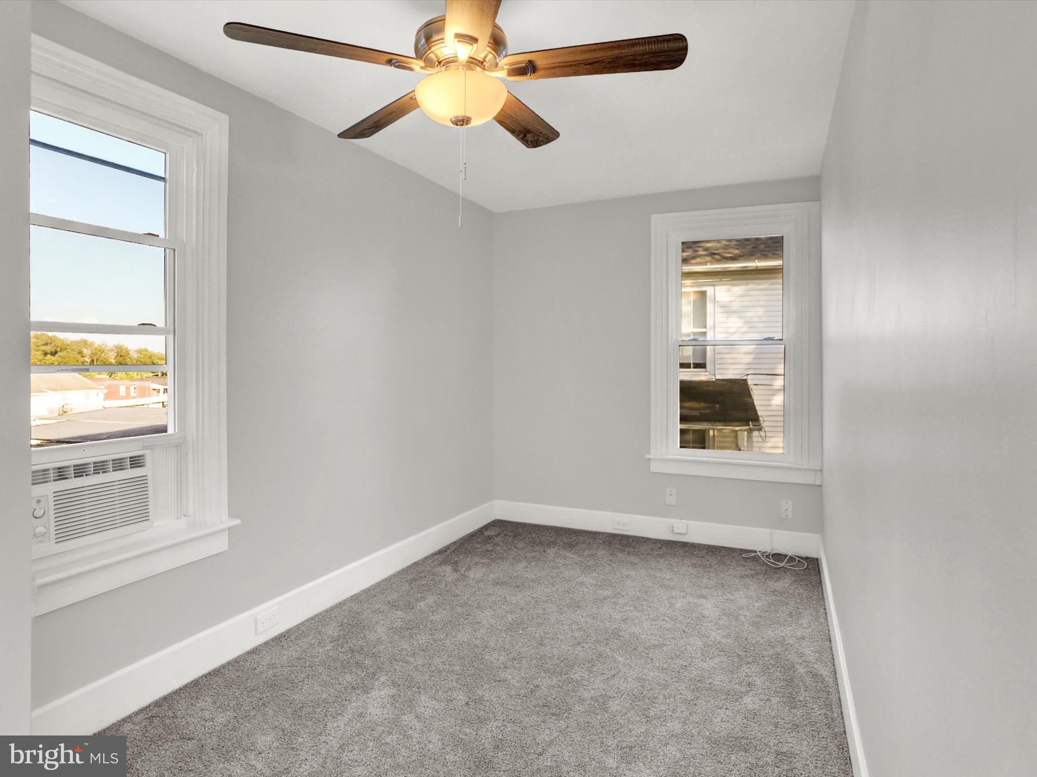 497 State Street Enola, PA 17025 - Photo 18 of 47 an empty room with windows and fan
