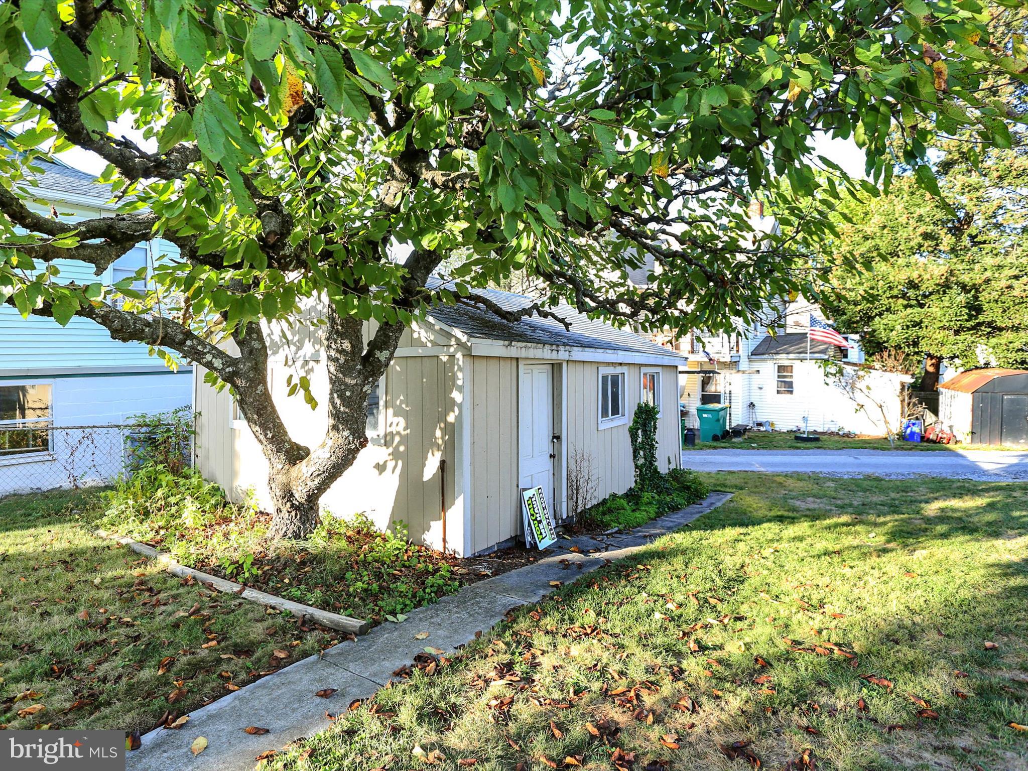 497 State Street Enola, PA 17025 - Photo 35 of 47 a view of a yard with plants and large trees