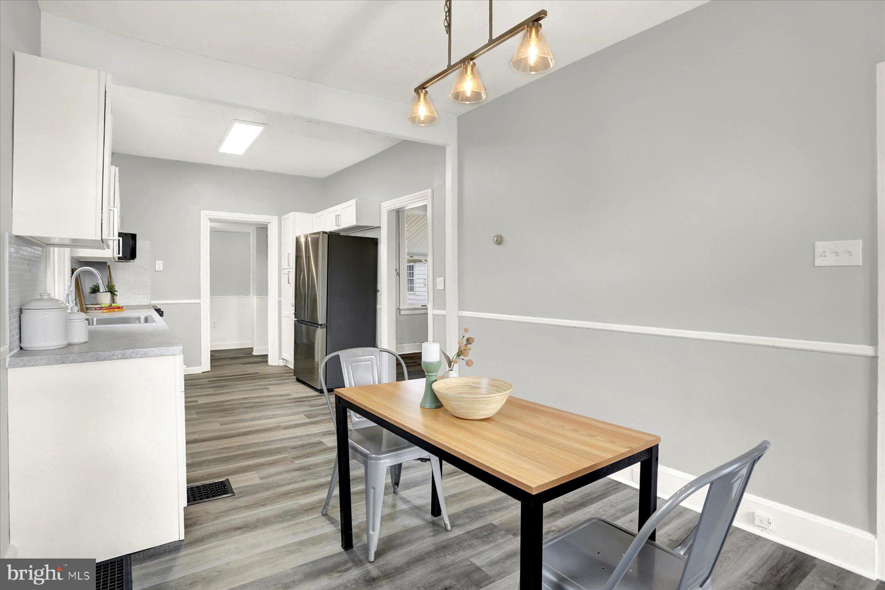 497 State Street Enola, PA 17025 - Photo 7 of 47 a view of a dining room with furniture and wooden floor