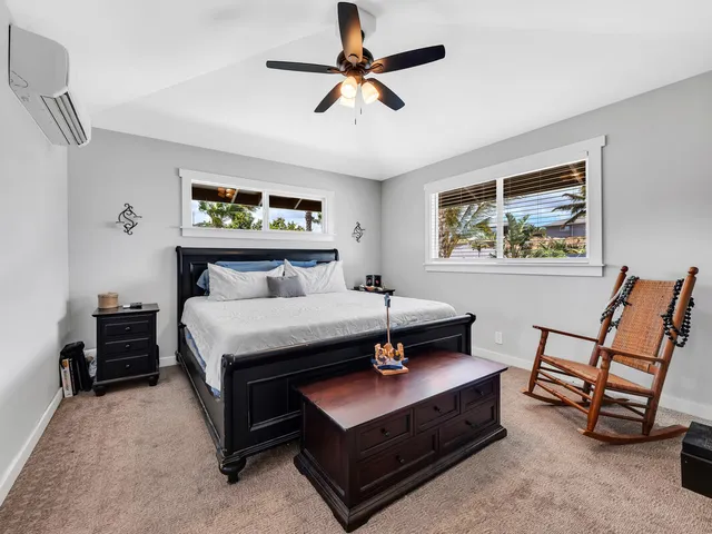 a bedroom with furniture and a chandelier