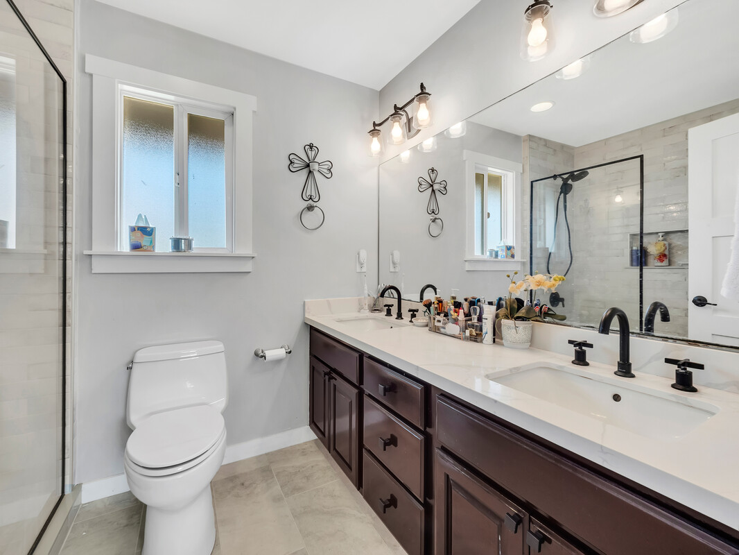 68-3679 Kokee Street Waikoloa, HI 96738 - Photo 14 of 28 a bathroom with a toilet sink and mirror