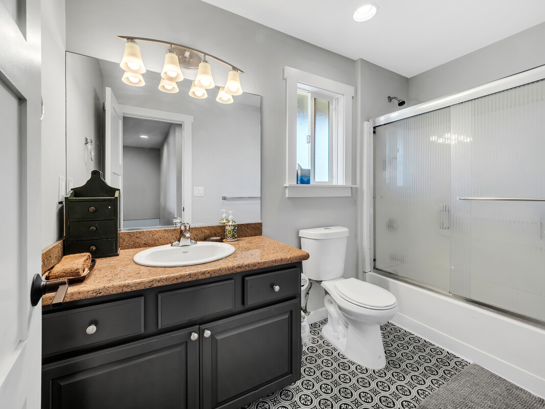 68-3679 Kokee Street Waikoloa, HI 96738 - Photo 19 of 28 a bathroom with a sink a toilet and a mirror