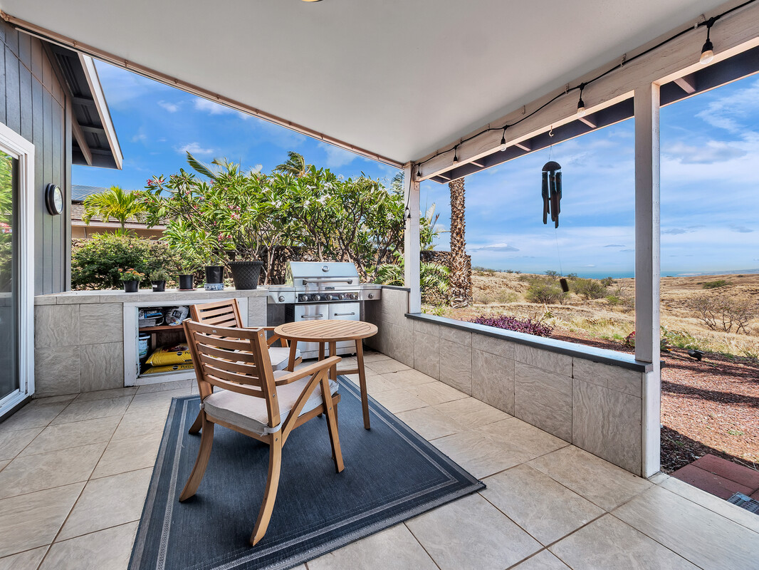 68-3679 Kokee Street Waikoloa, HI 96738 - Photo 21 of 28 a dining room with furniture and a floor to ceiling window