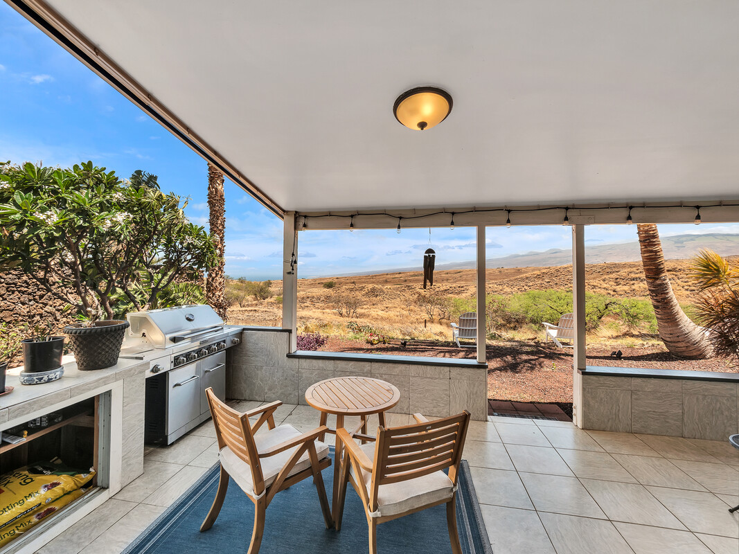 68-3679 Kokee Street Waikoloa, HI 96738 - Photo 22 of 28 a view of a kitchen with a table and chairs