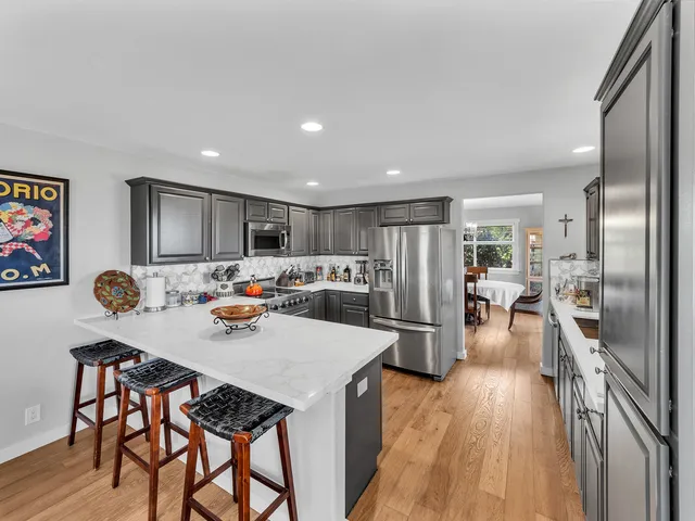 a view of a dining area with furniture and wooden floor