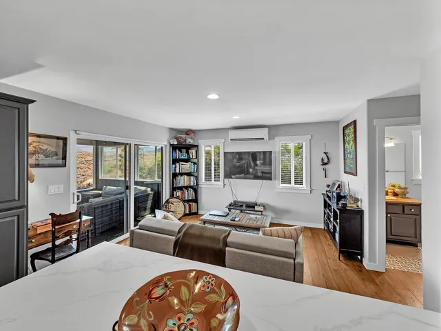 a living room with furniture and a large window