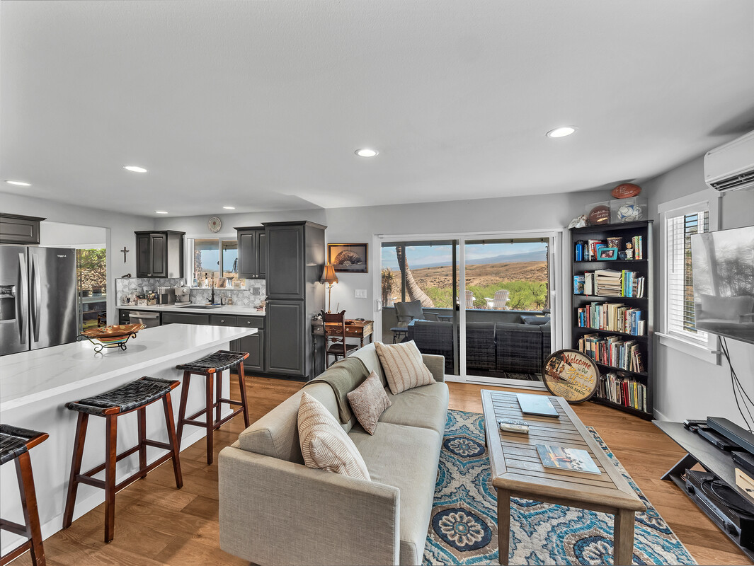 68-3679 Kokee Street Waikoloa, HI 96738 - Photo 10 of 28 a living room with furniture a rug and a large window