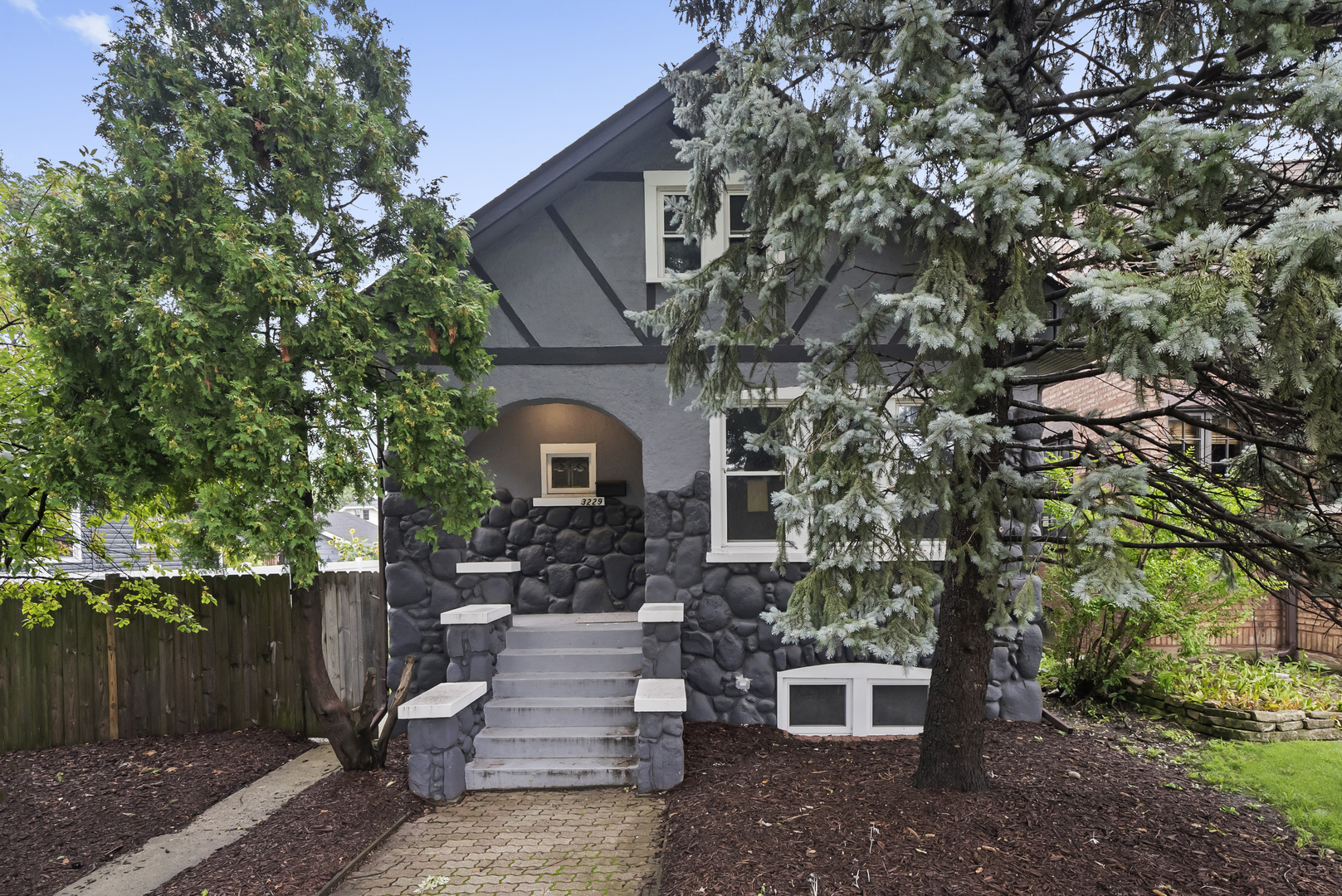 3229 Maple Avenue Brookfield, IL 60513 - Photo 1 of 14 a front view of a house with plants