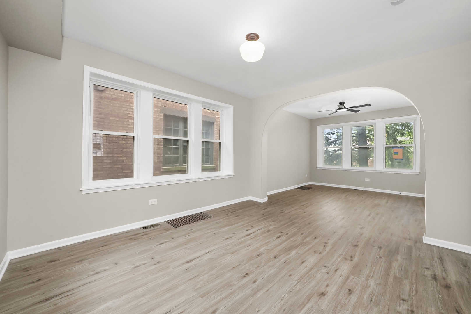 3229 Maple Avenue Brookfield, IL 60513 - Photo 3 of 14 an empty room with wooden floor and windows