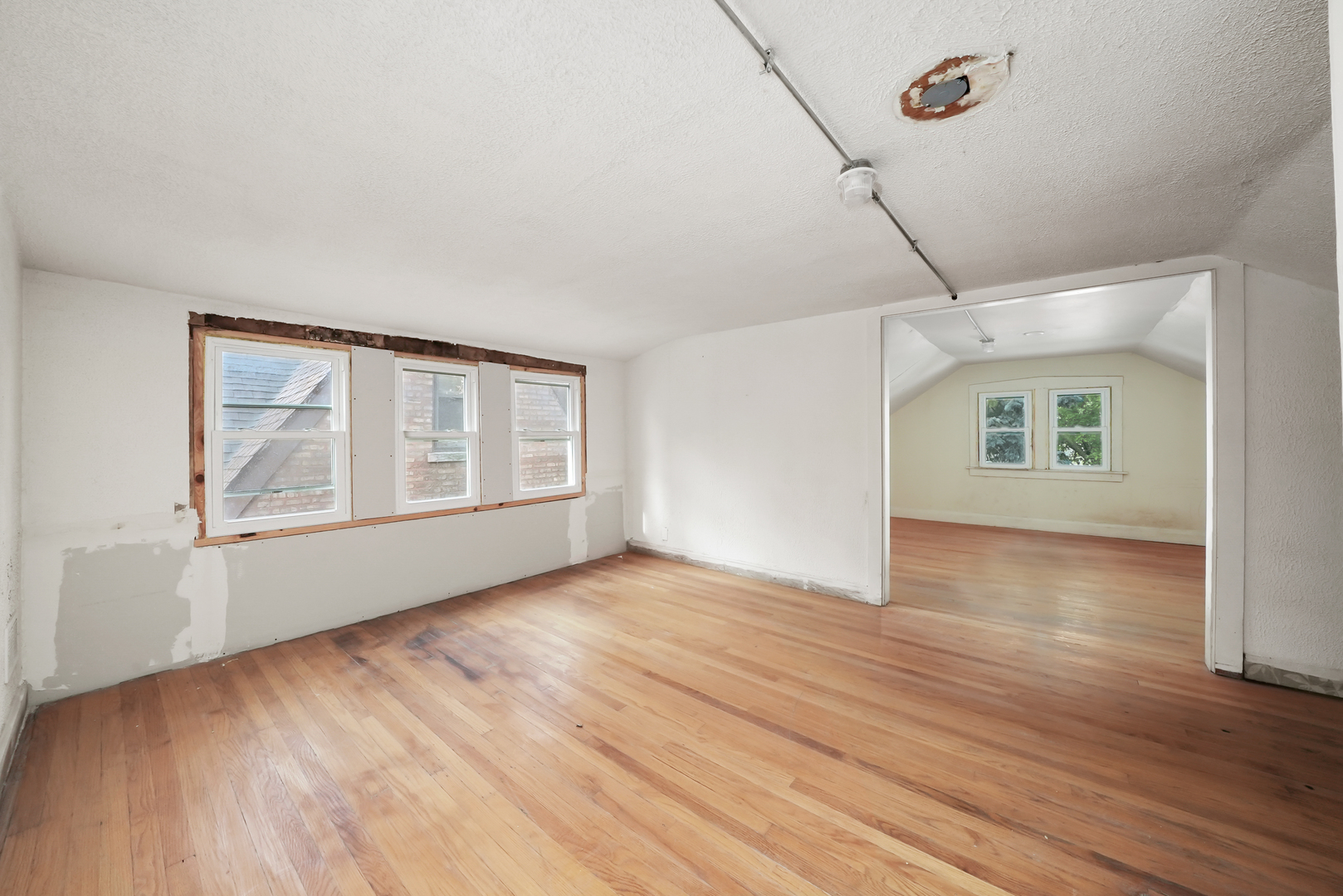 3229 Maple Avenue Brookfield, IL 60513 - Photo 10 of 14 a view of an empty room with wooden floor and a window