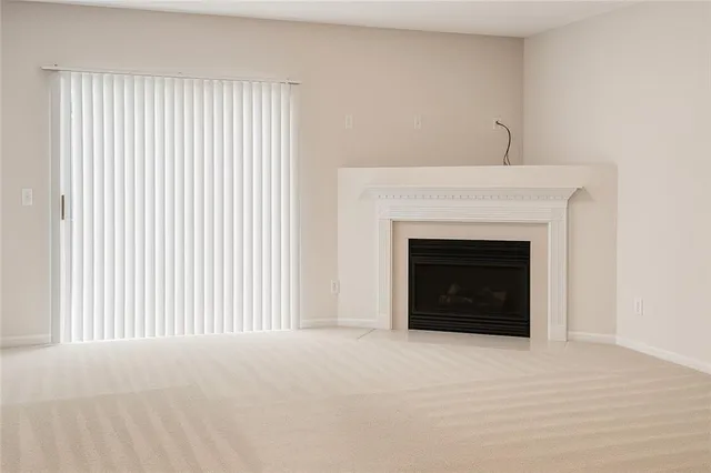 a view of a livingroom with a fireplace