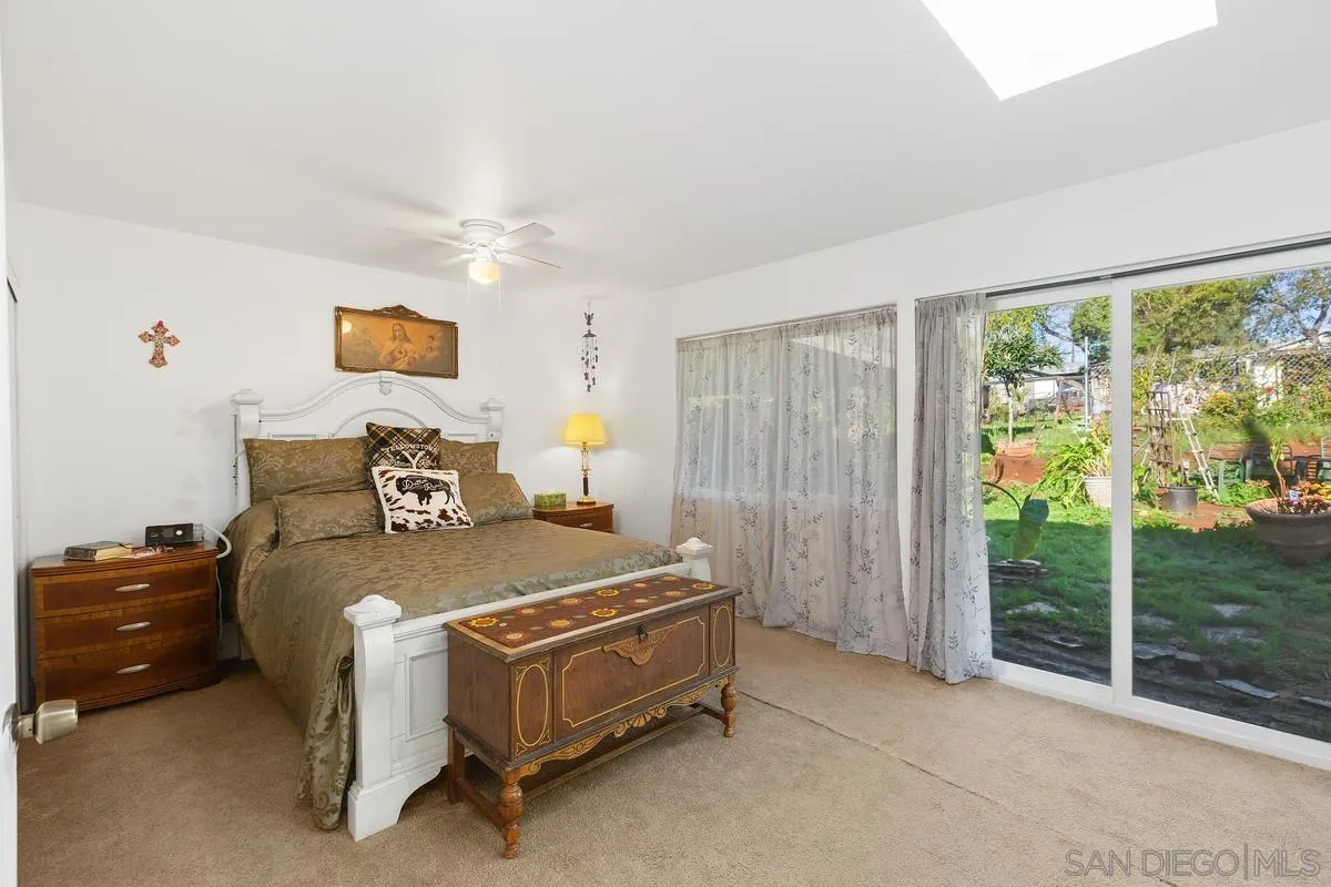 14164 Lyons Valley Road Jamul, CA 91935 - Photo 16 of 33 a bed sitting in a room next to a window