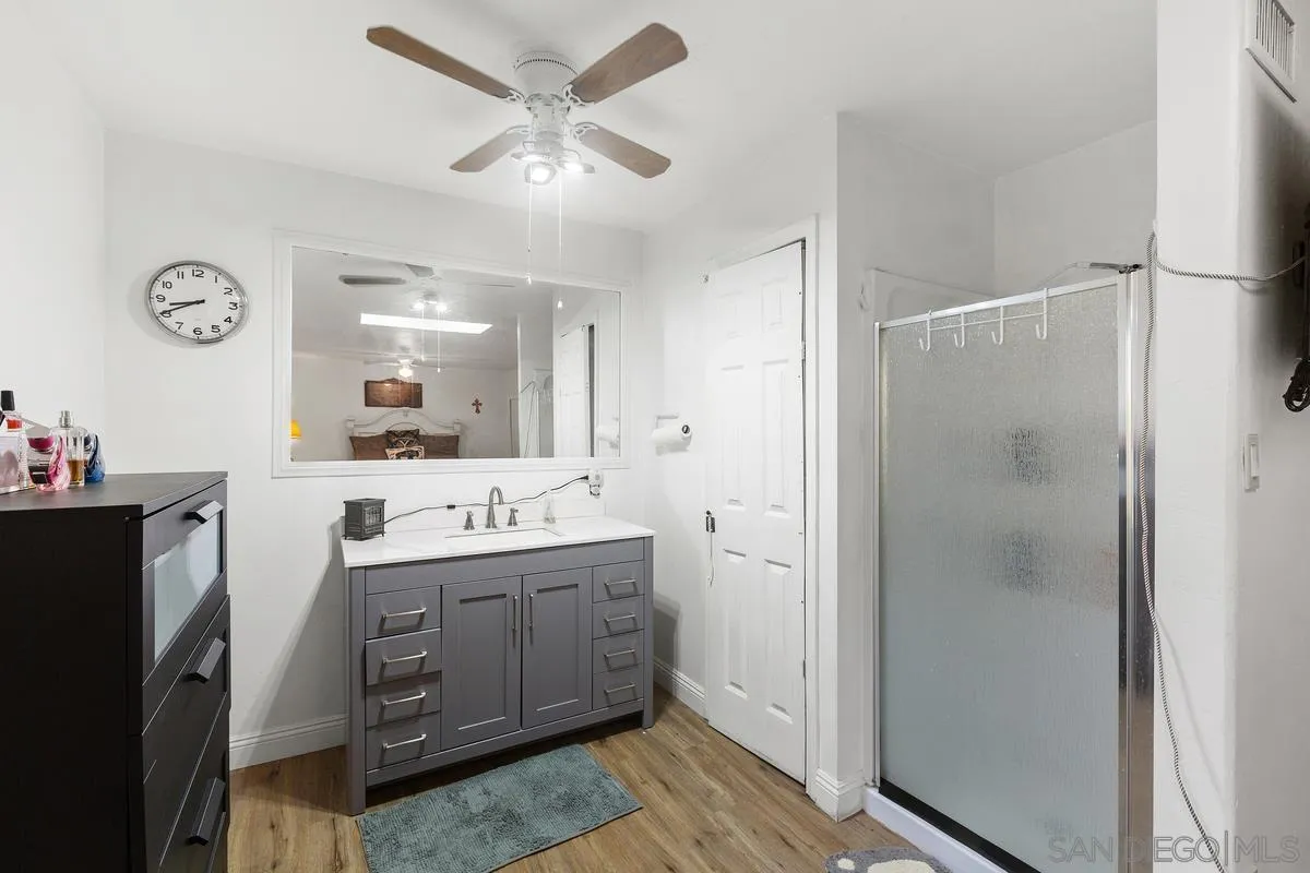 14164 Lyons Valley Road Jamul, CA 91935 - Photo 19 of 33 a bathroom with a double vanity sink mirror and shower