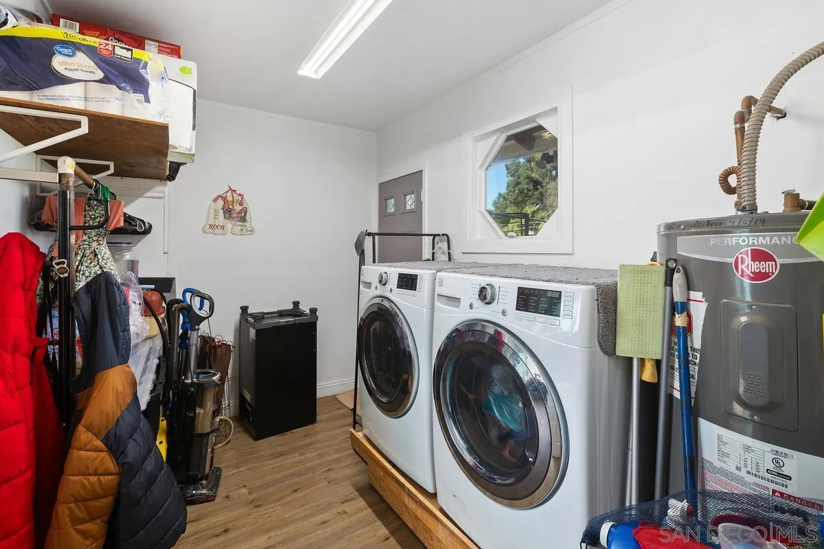 14164 Lyons Valley Road Jamul, CA 91935 - Photo 24 of 33 a view of a storage and utility room with washer and dryer