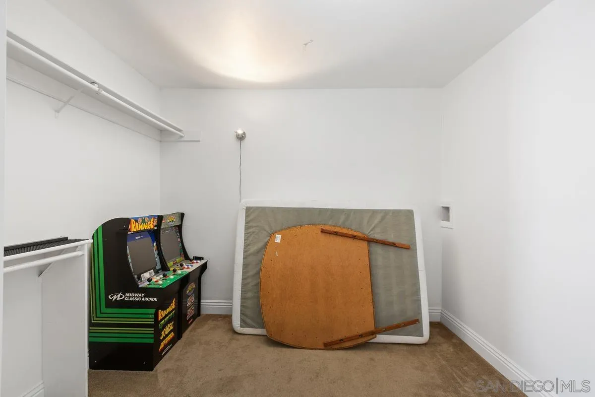 14164 Lyons Valley Road Jamul, CA 91935 - Photo 28 of 33 a room with a mirror and bed