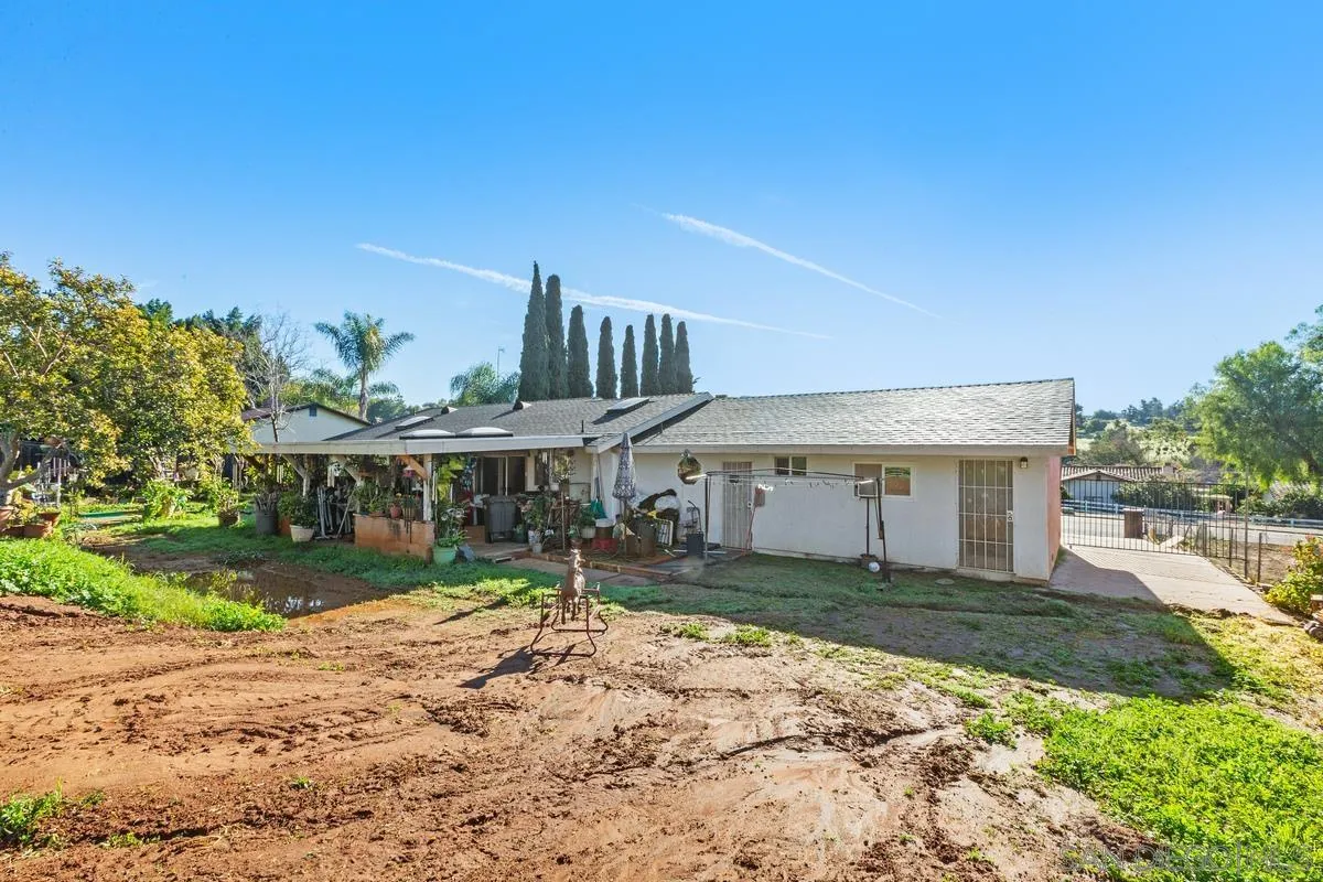 14164 Lyons Valley Road Jamul, CA 91935 - Photo 33 of 33 a front view of a house with a yard and potted plants
