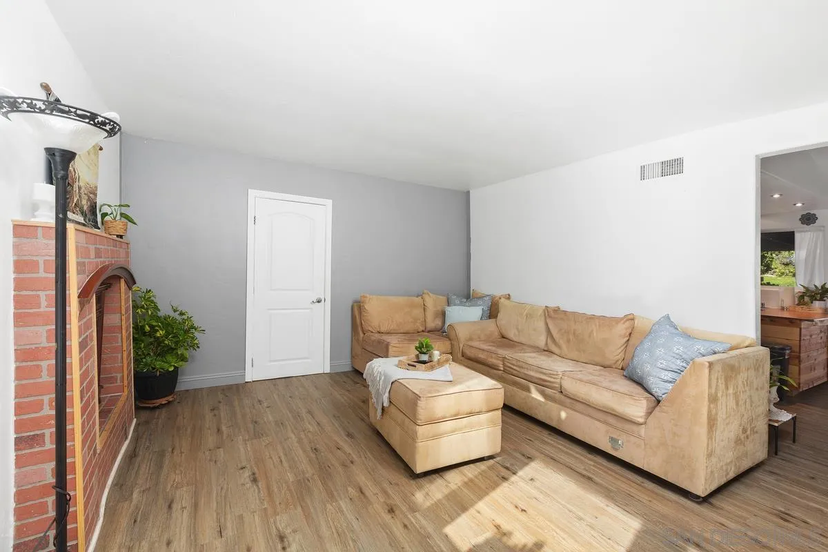 14164 Lyons Valley Road Jamul, CA 91935 - Photo 8 of 33 a living room with furniture and a wooden floor