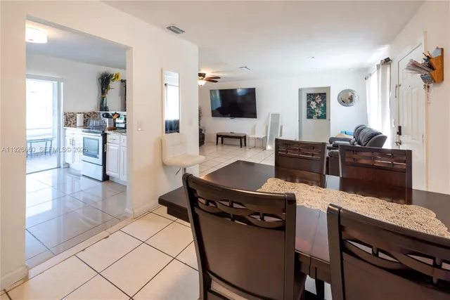 a kitchen with a table and chairs in it