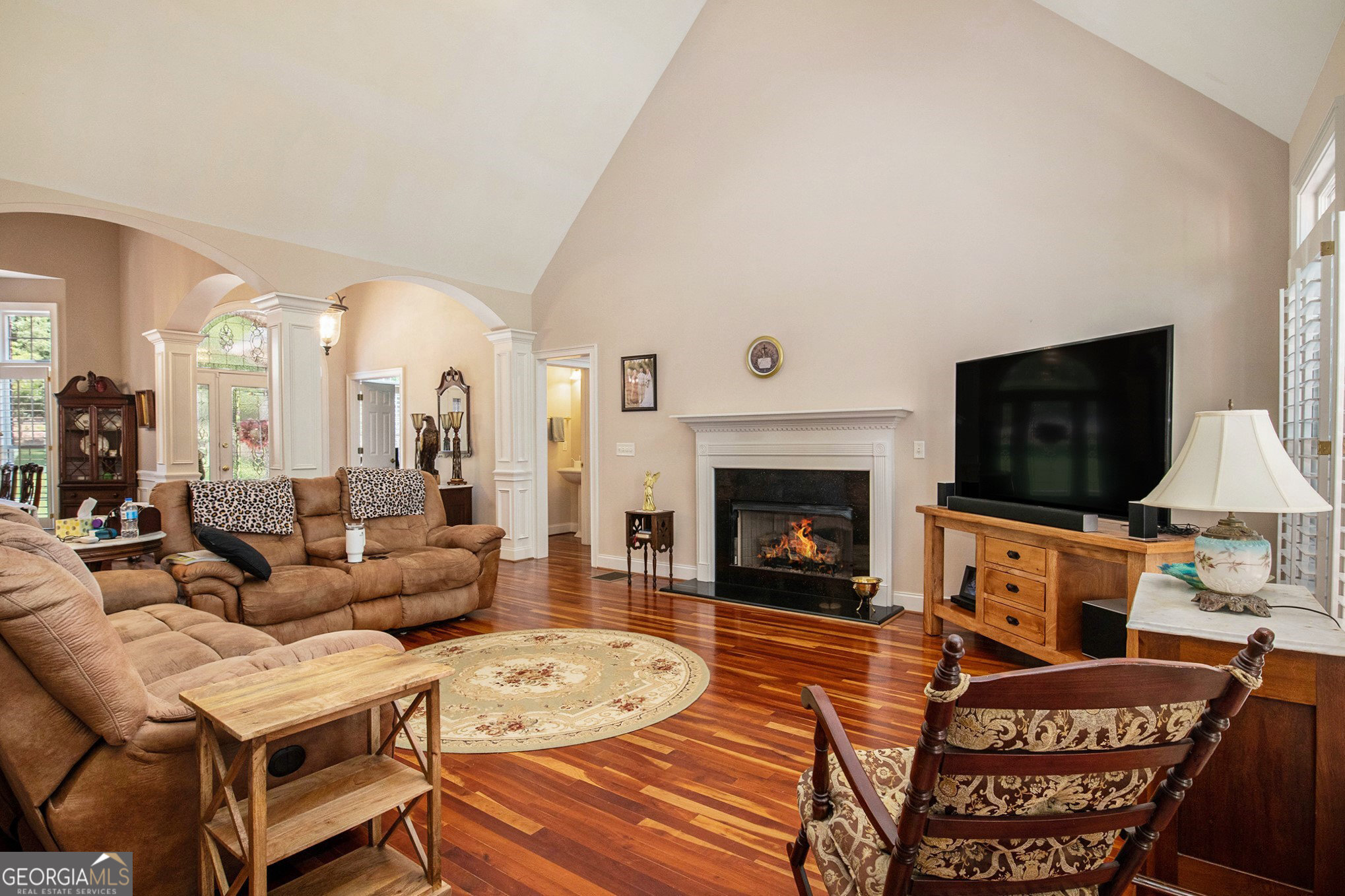 131 Winesap Way Clarkesville, GA 30523 - Photo 12 of 65 a living room with furniture a flat screen tv and a fireplace