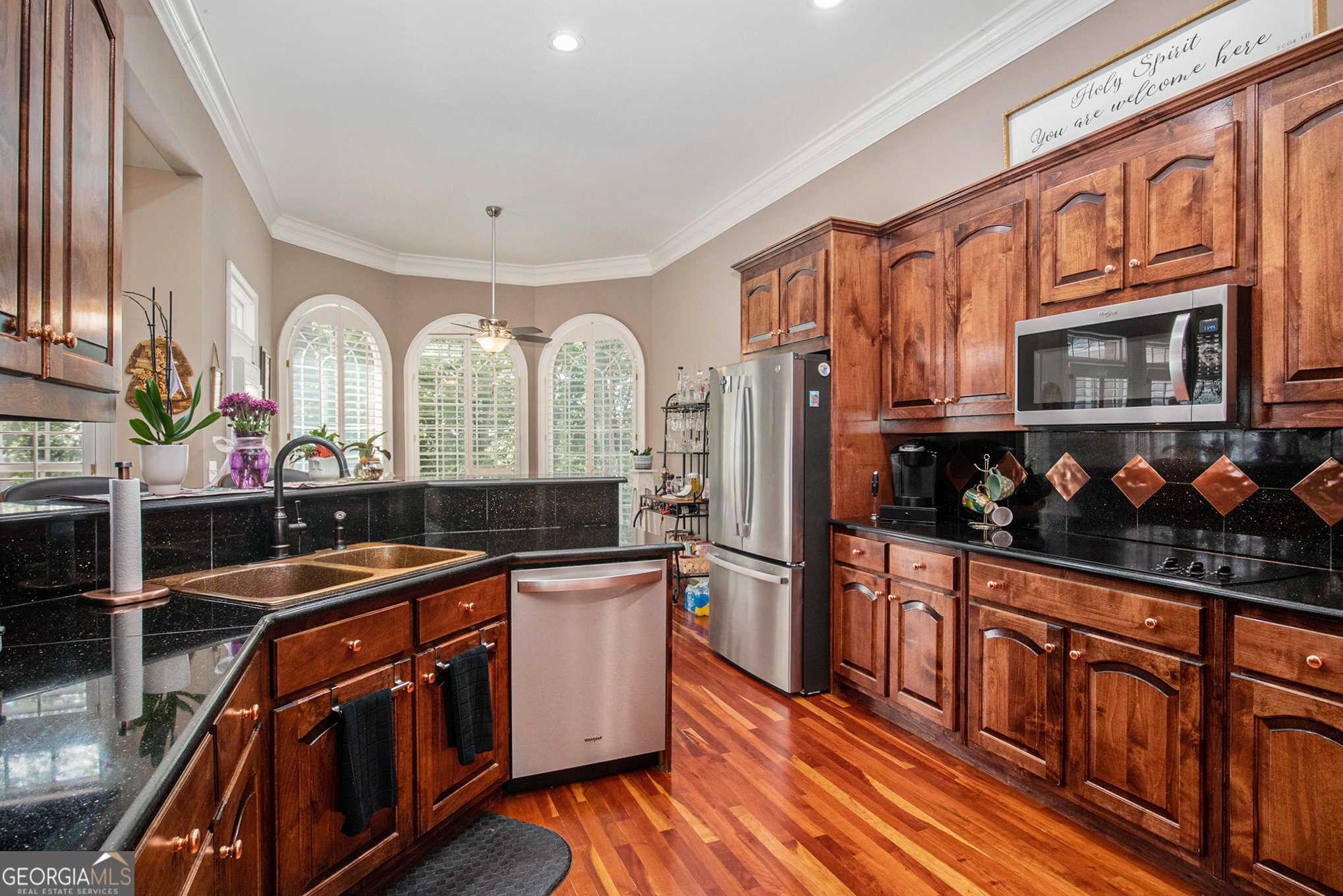 131 Winesap Way Clarkesville, GA 30523 - Photo 16 of 65 a kitchen with stainless steel appliances a sink cabinets and wooden floor