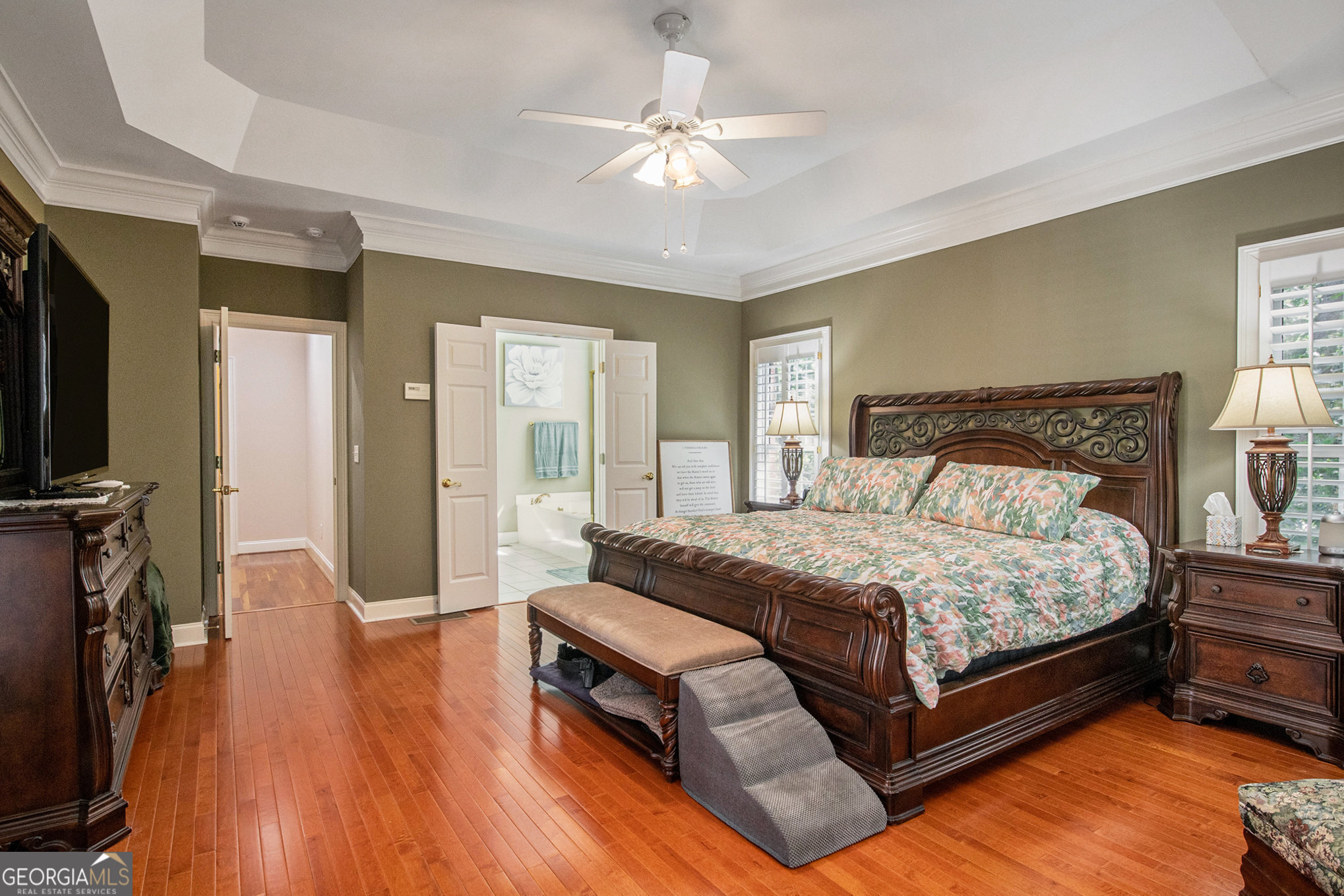 131 Winesap Way Clarkesville, GA 30523 - Photo 20 of 65 a bedroom with a bed and a chandelier