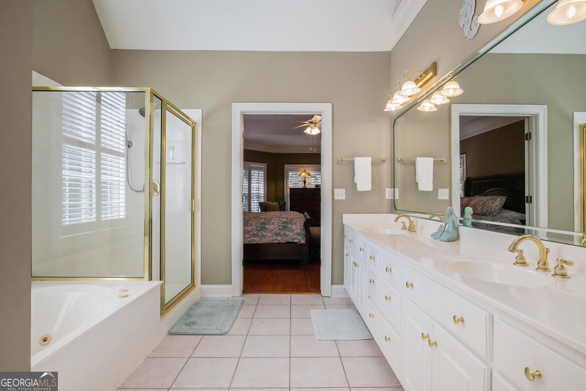 131 Winesap Way Clarkesville, GA 30523 - Photo 24 of 65 a spacious en suite bathroom with a double vanity sink a large mirror and a bathtub