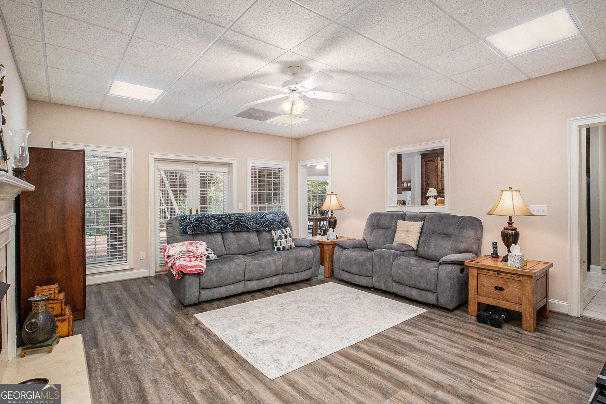 131 Winesap Way Clarkesville, GA 30523 - Photo 32 of 65 a living room with furniture and a wooden floor