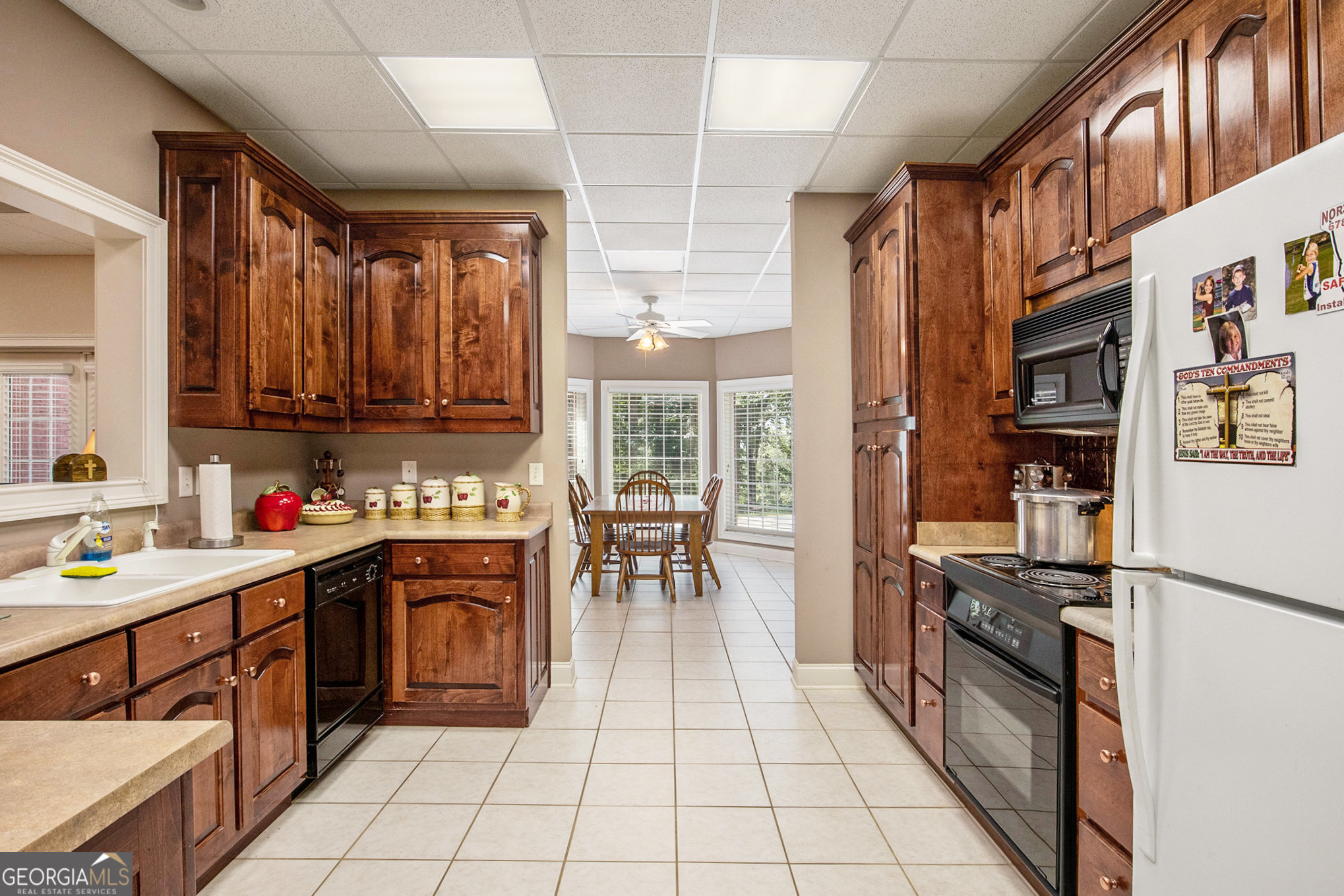 131 Winesap Way Clarkesville, GA 30523 - Photo 37 of 65 a kitchen with stainless steel appliances granite countertop a stove top oven a sink dishwasher and cabinets with wooden floor