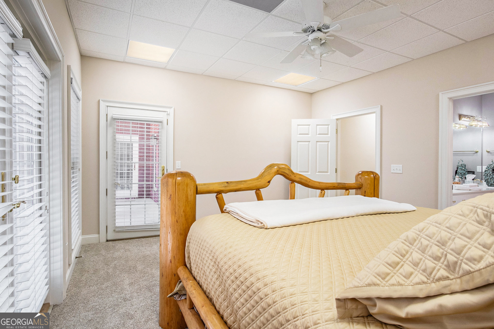 131 Winesap Way Clarkesville, GA 30523 - Photo 41 of 65 a bed sitting in a spacious bedroom next to a window