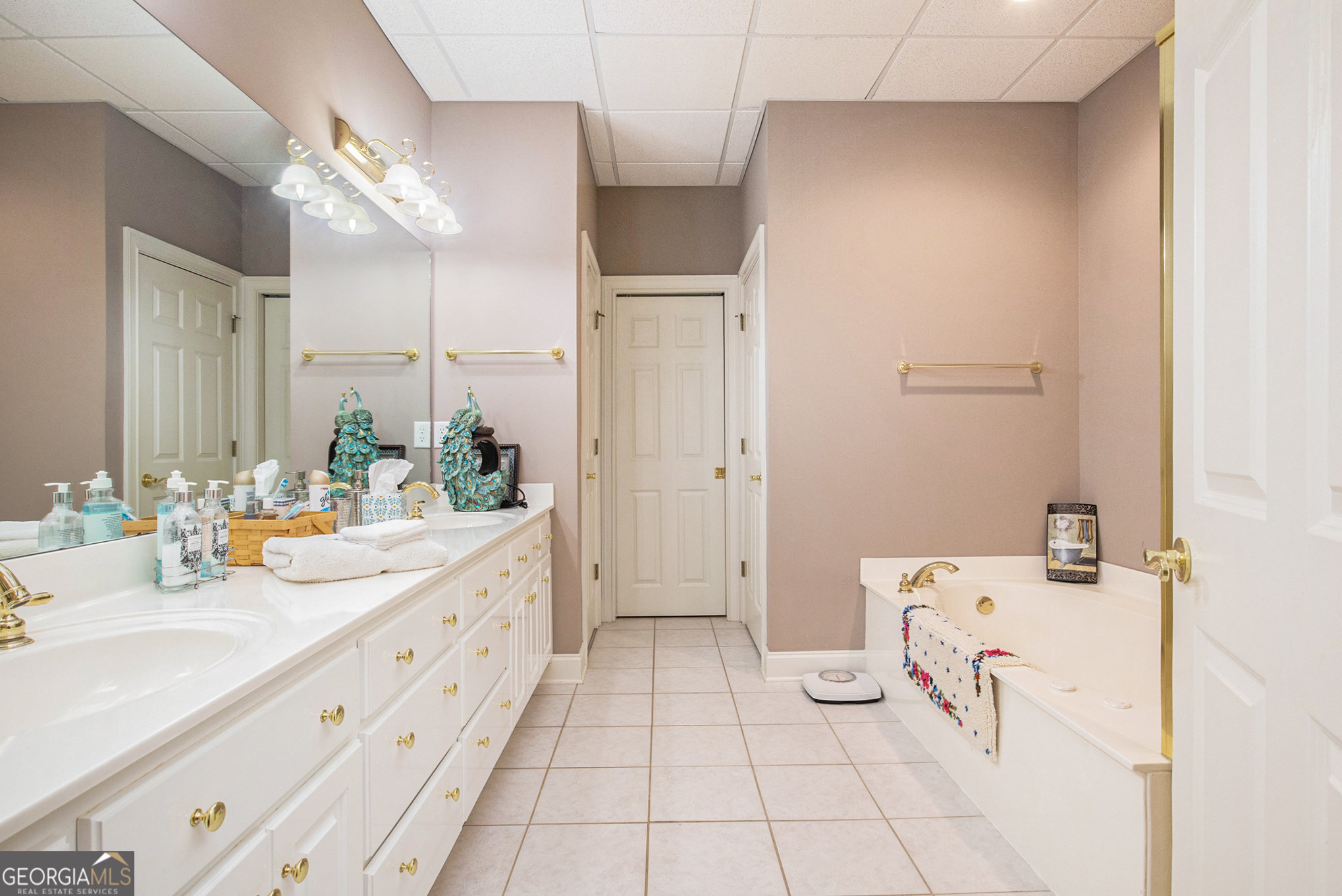 131 Winesap Way Clarkesville, GA 30523 - Photo 42 of 65 a bathroom with a double vanity sink mirror and shower