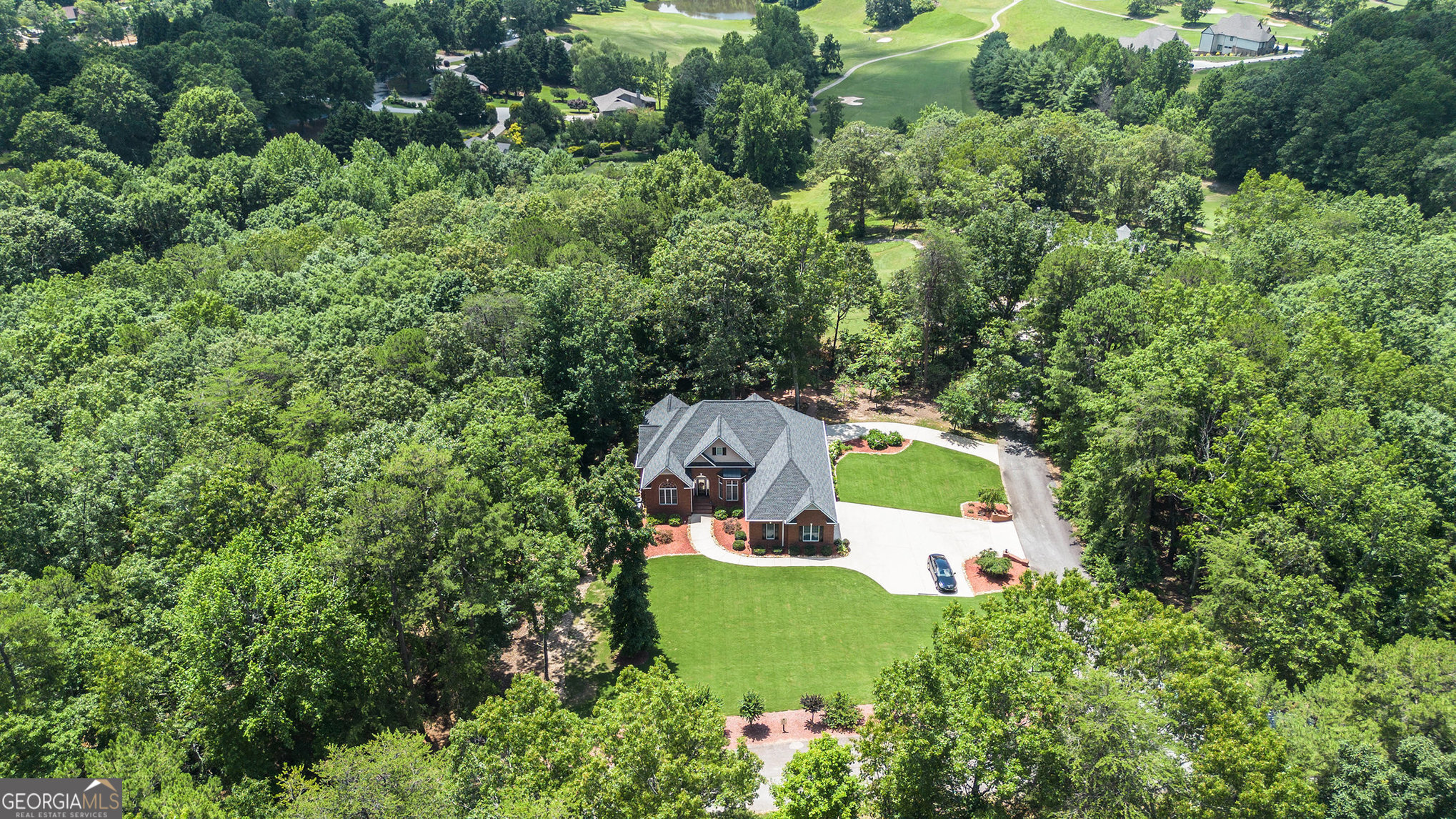 131 Winesap Way Clarkesville, GA 30523 - Photo 56 of 65 an aerial view of a house with a yard and outdoor seating