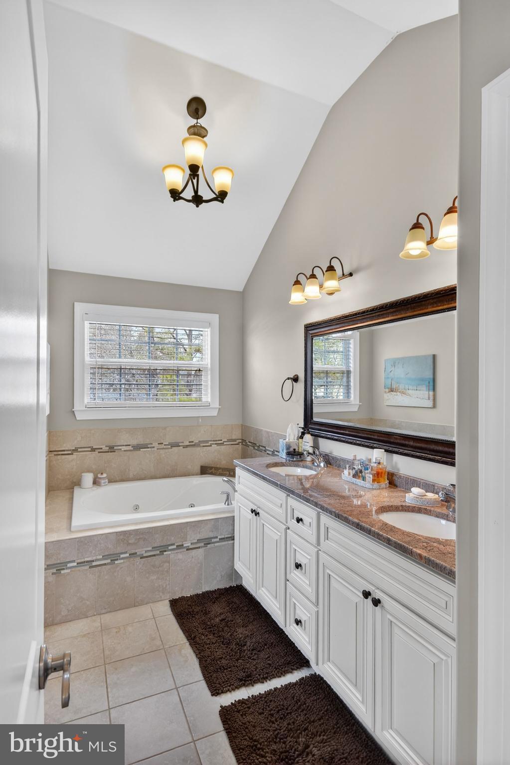 95 Savannah Road Manchester Township, NJ 08757 - Photo 22 of 37 a bathroom with a tub sink and mirror