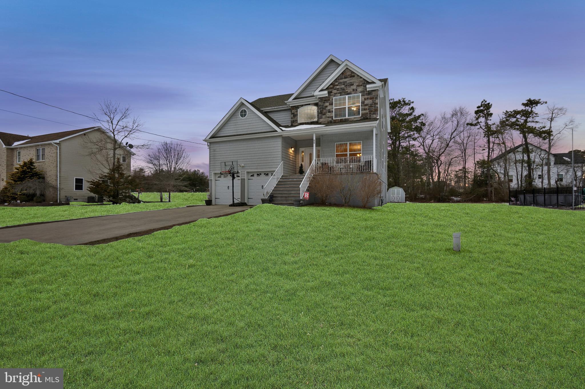 95 Savannah Road Manchester Township, NJ 08757 - Photo 33 of 37 a view of a house with a big yard and large trees