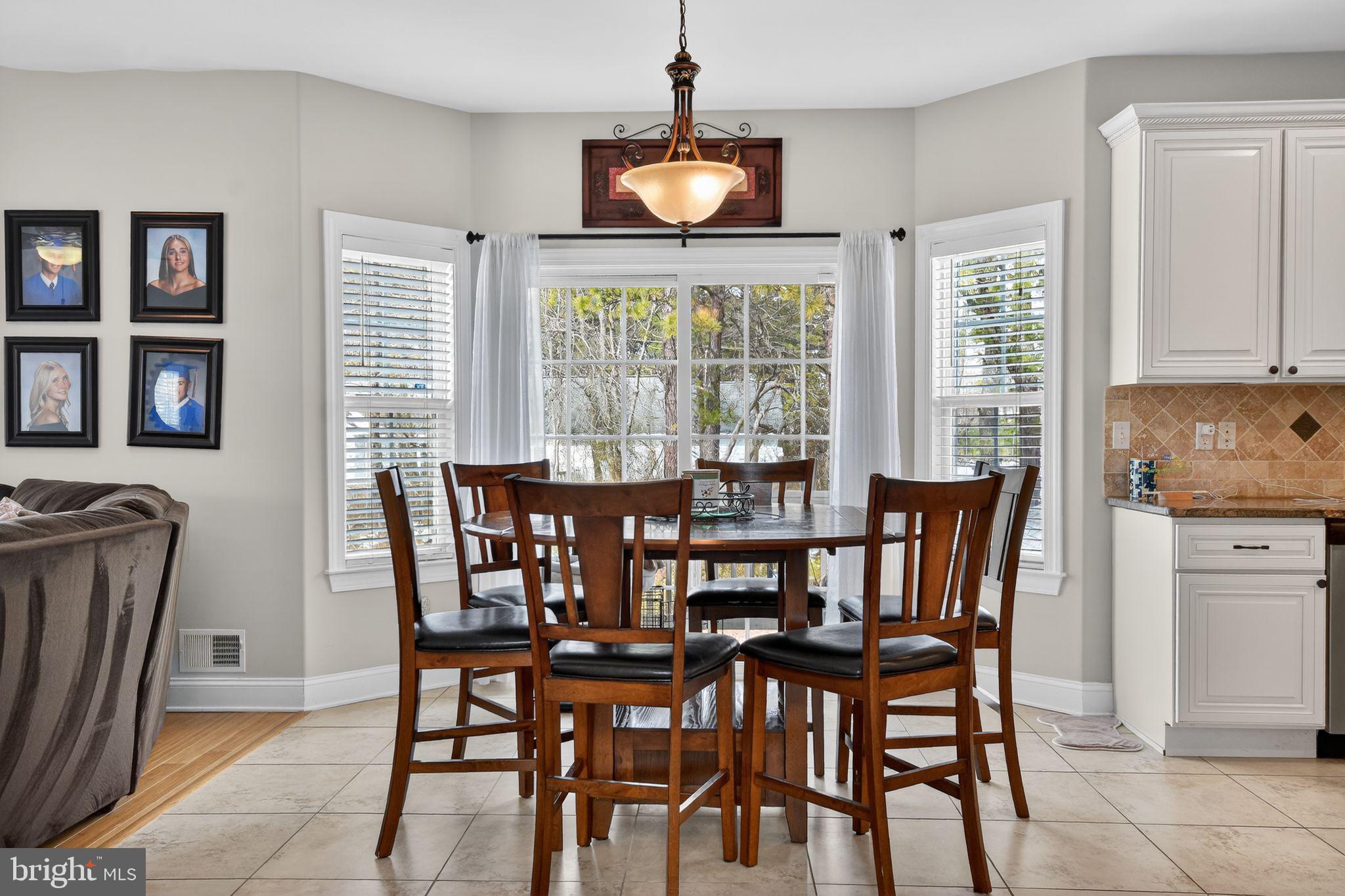 95 Savannah Road Manchester Township, NJ 08757 - Photo 8 of 37 a view of a dining room with furniture window and outside view
