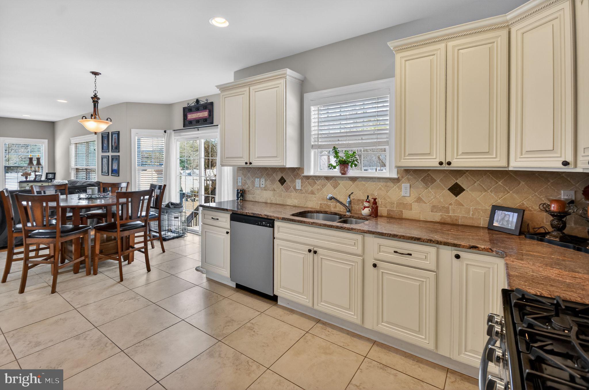 95 Savannah Road Manchester Township, NJ 08757 - Photo 10 of 37 a kitchen with sink cabinets and window