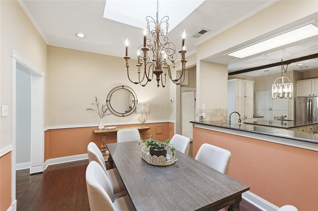 9121 6th Street Frisco, TX 75033 - Photo 10 of 27 a view of a dining room with furniture a chandelier and wooden floor