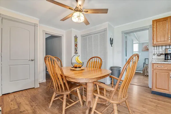 a dining room with furniture and window
