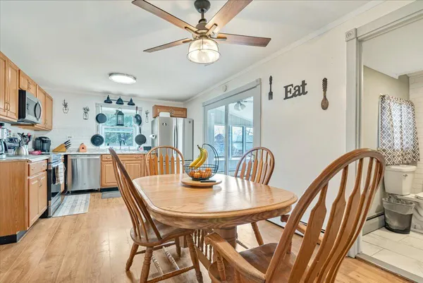 a kitchen with stainless steel appliances granite countertop a refrigerator sink and microwave