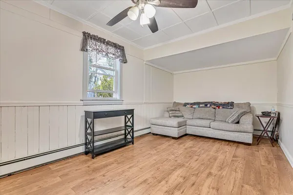 a view of room with furniture and a ceiling fan