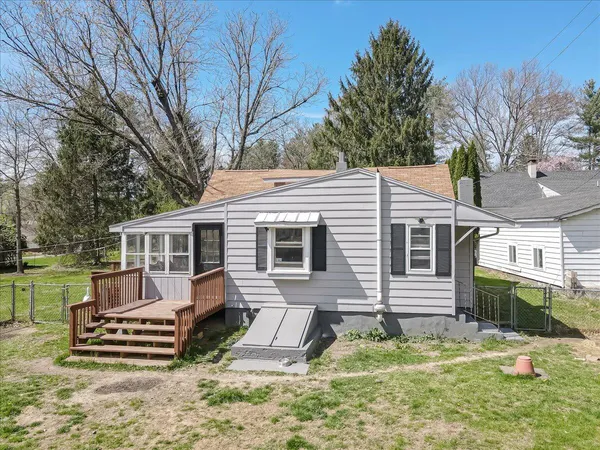 an aerial view of a house with outdoor space