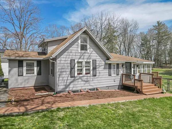 a front view of house with yard outdoor seating and barbeque oven