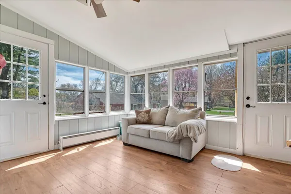 a living room with furniture and a large window
