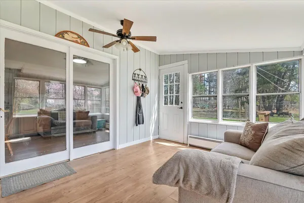 a living room with furniture and a large window